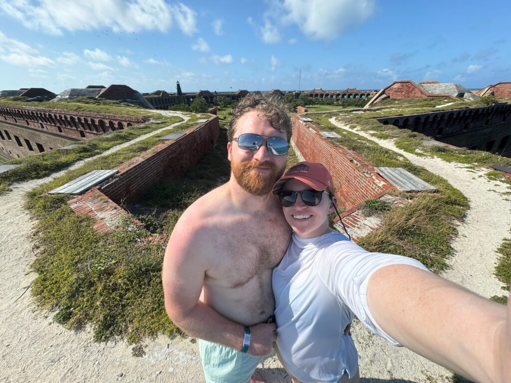 Our 6-Day Itinerary to Florida's 3 National Parks couple standing on the top of fort jefferson in dry tortugas national park