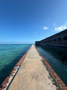 Dry Tortugas National Park: Our Half-Day, Seaplane Experience walkway beside Fort Jefferson and turquoise water at Dry Tortugas National Park