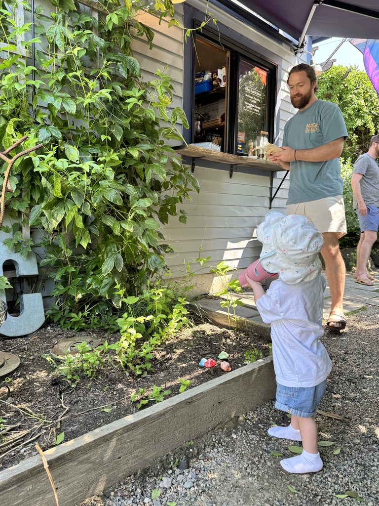 Rhode Island Family Vacation: Our 4-Day Narragansett Itinerary Dylan and Oella picking up our order at Village Hearth Bakery & Cafe