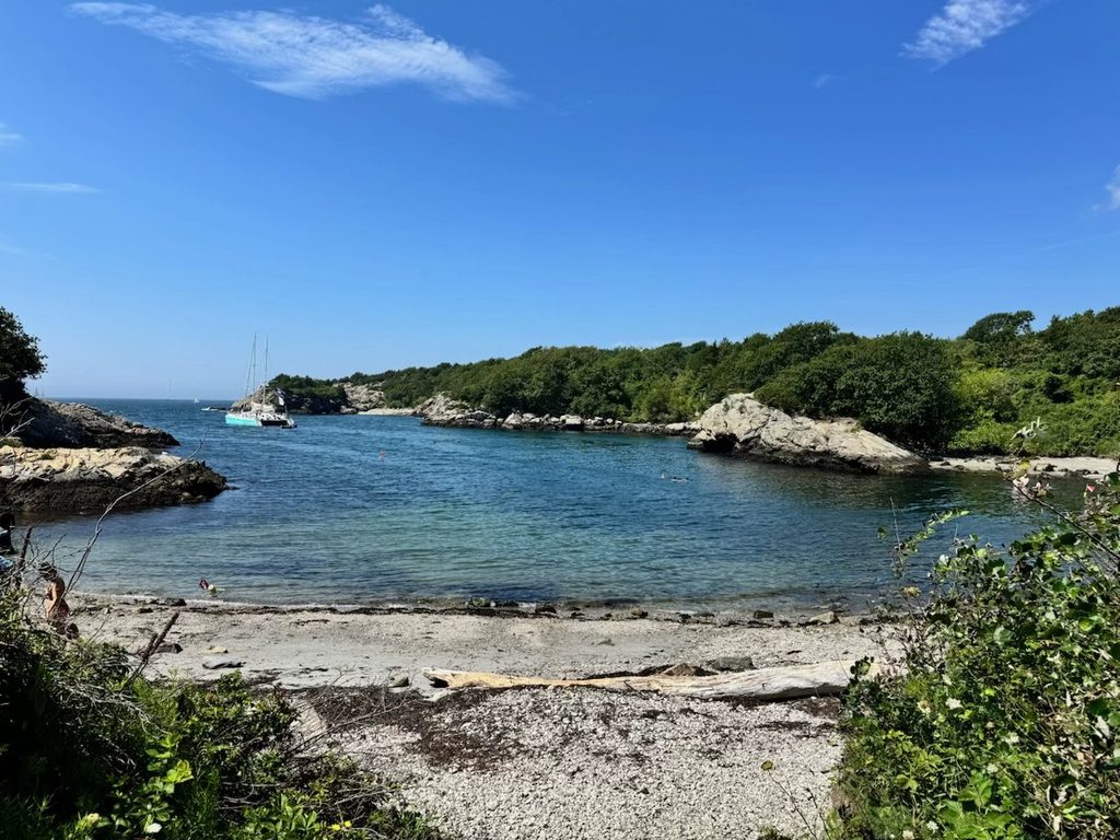 Rhode Island Family Vacation: Our 4-Day Narragansett Itinerary Rocky coastline and turquoise water at Fort Wetherill State Park.