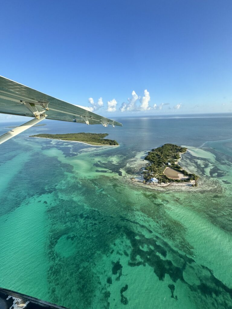 Our 6-Day Itinerary to Florida's 3 National Parks Aerial view of the turquoise water and small islands near Dry Tortugas National Park from a seaplane.