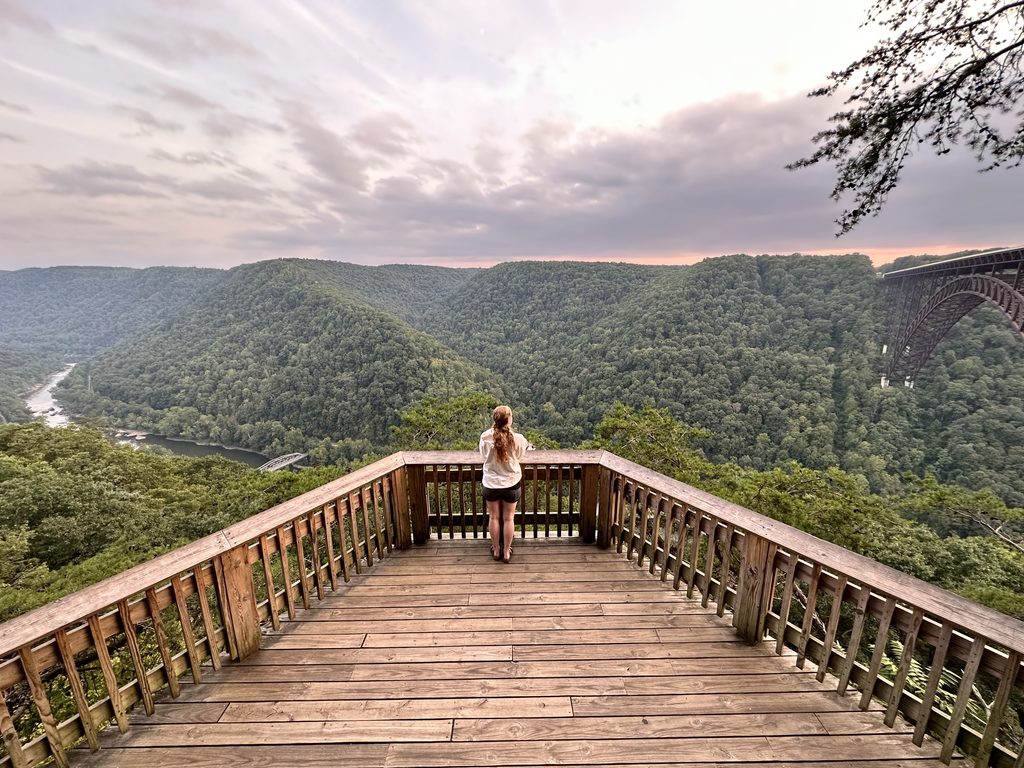 2 Days in New River Gorge National Park Hannah standing at the Canyon Rim Visitor Center overlook in New River Gorge National Park