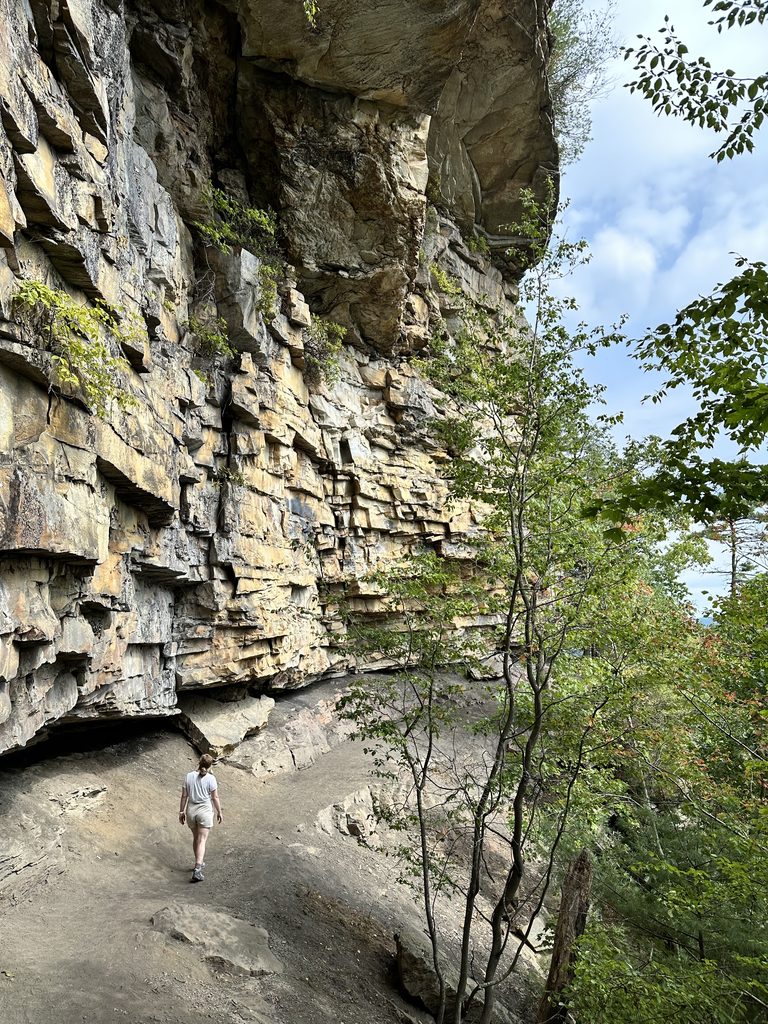 2 Days in New River Gorge National Park Hannah walking alongside Castle Rock Trail in New River Gorge National Park