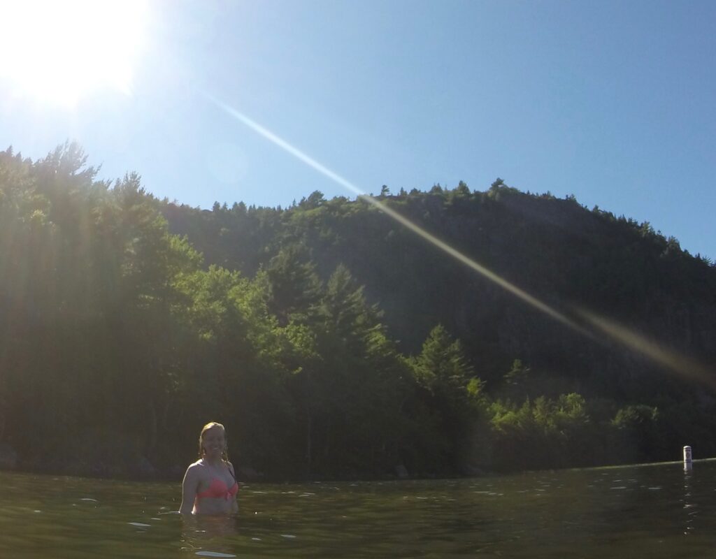 3-Day Acadia National Park Camping Itinerary Hannah in the water at Sand Beach in Acadia National Park